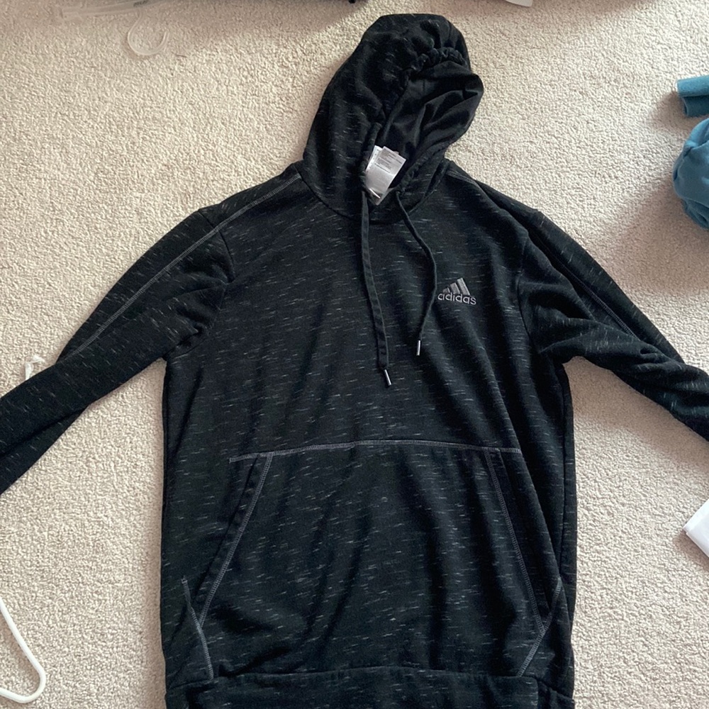 I am selling a black adidas jacket in perfect condition, unisex fit.